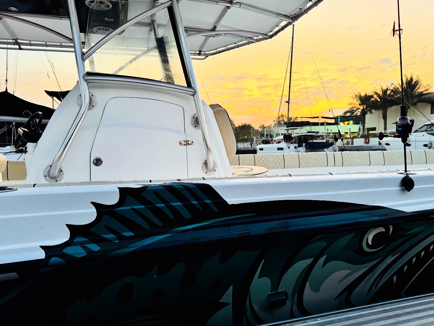 B2B05A21-A3F4-4502-8946-72E8696328AA Zaya Green boat bow at sunset in the marina